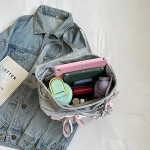 Chic grey rucksack with pink bows and large capacity for tablet, water bottle and umbrella
