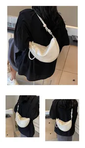 Detailed back view of off-white dumpling bag with elegant knotted shoulder strap design