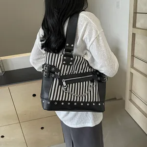 Black and white striped canvas tote bag with punk metal chains and silver studs