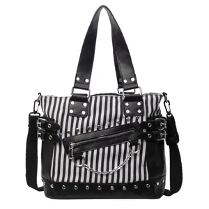 Gothic style black and white striped handbag with silver studs and metal chains