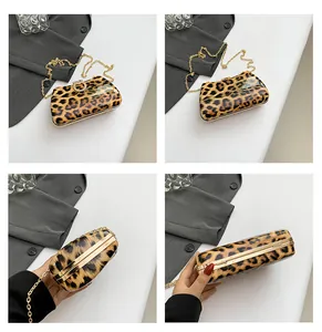 Detail view of leopard print hard-shell evening bag with gold chain strap in multiple angles