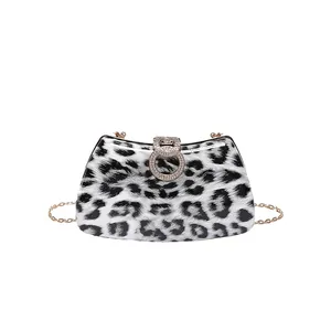 Luxury leopard print evening bag with sparkling rhinestone buckle and gold chain strap