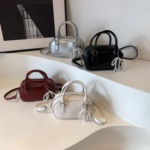 Chic Boston handbag set in shiny PU leather with pearl bow charm and crossbody strap