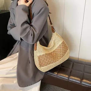 Large straw tote bag for women with woven mesh detail and brown leather straps