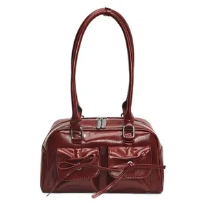 Deep red glossy PU leather bowling bag with bow details and dual shoulder straps