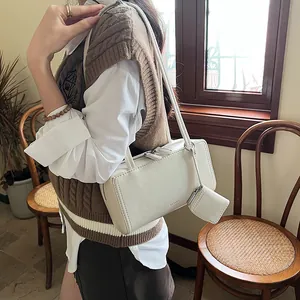 Minimalist cream white rectangular baguette bag with small detachable pouch and shoulder strap