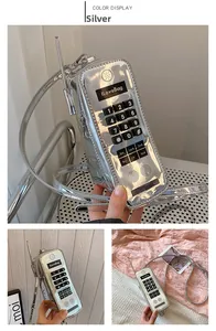 Detailed view of silver vintage telephone-shaped crossbody bag with retro keypad design