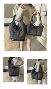 Detailed comparison of medium and large grey tote bags with black bow pattern and accents