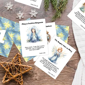 Detailed watercolor Christmas advent cards with bible verses on a cozy wooden surface