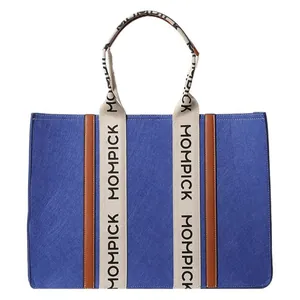 Large blue felt tote bag with MOMPICK woven straps and leather trim in a 45-degree view