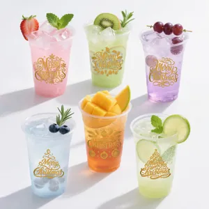 Pegatinas de transferencia UV DTF navideñas en vasos con motivos festivos dorados