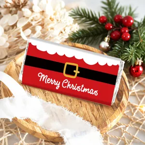 Detailed view of Christmas labels on candy bars with festive Santa suit patterns