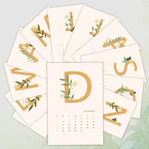 Close-up of 12-pack minimalist 2026 floral calendar cards with elegant letter patterns