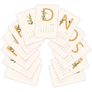 Detailed grid of 12 minimalist 2026 calendar cards with orange letters and floral art