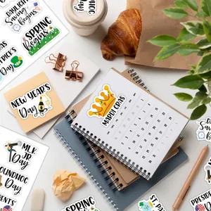 Flat lay of colorful holiday planner stickers for Mardi Gras and St. Patrick's Day journaling