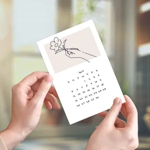Minimalist 2026 calendar card featuring hand-drawn flowers and April monthly layout