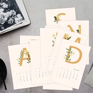 Minimalist 2026 calendar cards with yellow letters and floral patterns for wall decoration
