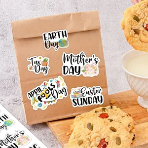 Detail of holiday planner stickers featuring Earth Day and Easter on a kraft paper bag