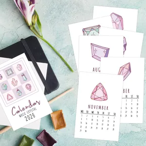 Detailed view of 2026 Magic Crystal calendar cards with hand-drawn art and stationery