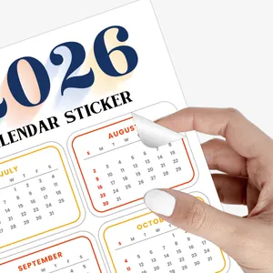 Close-up of peeling a 2026 calendar sticker from a set for planner decoration