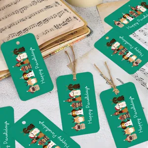 Close-up of Happy Pawlidays gift tags with cartoon dogs on a vintage music sheet