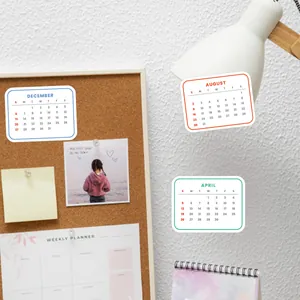 Minimalist 2026 calendar stickers applied to a desk lamp and cork board for organization