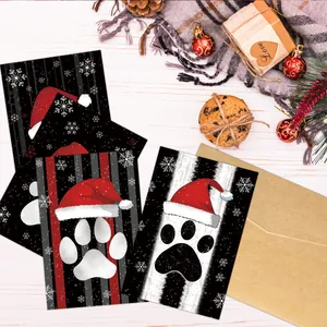 Christmas cards set with envelopes featuring cute dog paw prints and snowflake designs