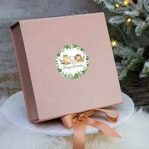 Pink watercolor forest animal birthday sticker on a gift box with a satin ribbon bow