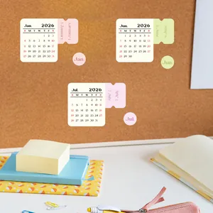 2026 calendar stickers with 12 months for journals on a corkboard with office supplies