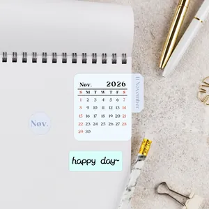 Detailed view of 2026 calendar stickers and monthly index tabs on a notebook