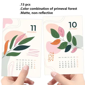 Detail showing matte minimalist 2026 calendar cards with green plant illustrations