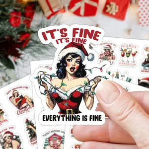Macro shot of retro Christmas sticker with Pin-up girl and festive holiday lights