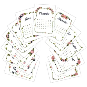 Detailed fan-shaped arrangement of 12 floral 2026 monthly calendar cards on white background