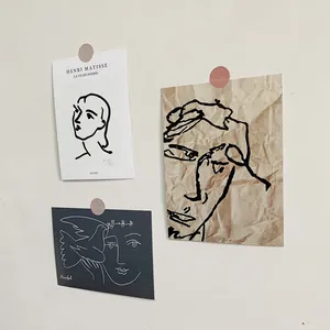 Detail of Henri Matisse art posters featuring minimalist abstract line drawings on textured paper