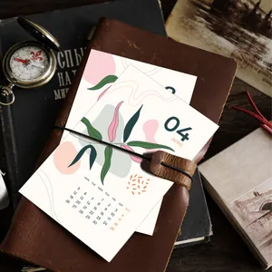 Minimalist 2026 botanical calendar card with abstract April illustration on vintage props
