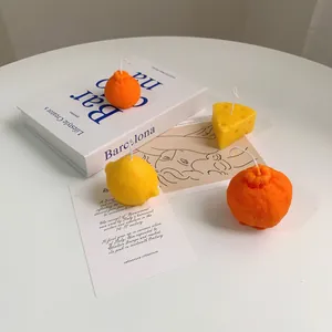 Artistic fruit and cheese shaped scented soy candles for aesthetic home decor