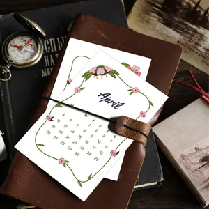 2026 minimalist monthly calendar card for April with hand-drawn floral border decoration