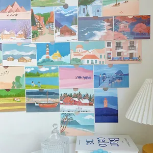 A set of 15 minimalist landscape wall decor cards arranged on a white wall in a cozy home setup
