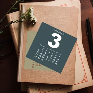 Minimalist 2026 calendar card on vintage books with dried flowers for wall decor