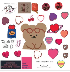 Flat lay of cute pink heart stickers with brown bear and sweet dessert illustrations