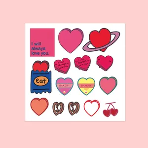 Flat lay of pink and red heart stickers with romantic quotes for notebooks and journals