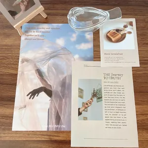 Artistic glass storage tray for jewelry on a desk with decorative greeting cards