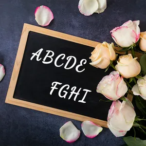 Rustic wood frame chalkboard with white ABCDE letters on a blue textured background
