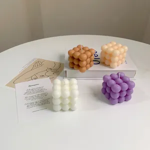 Bubble cube soy wax scented candles in brown, white, purple and yellow aesthetic decor