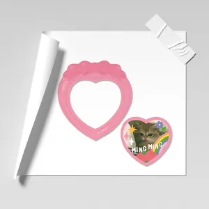 Pink heart-shaped photo frame with bow detail and cute cat decorative stickers