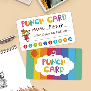Close-up of colorful cartoon reward punch cards for kids with school stationery background