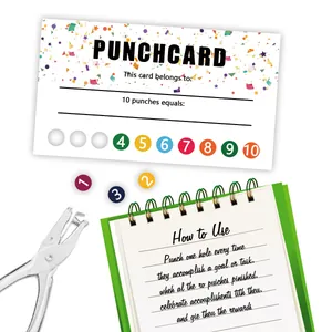 Close-up of colorful cartoon reward cards with hole punch tool and instructional booklet