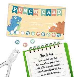 Detail of dinosaur punch cards for kids with silver metal hole puncher and green notebook