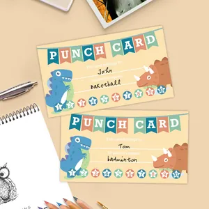 Macro view of dinosaur punch cards for kids with name and reward fields on paper