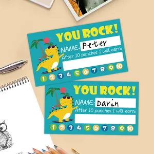 Detail showing two dinosaur punch cards for kids' rewards with cute cartoon illustrations